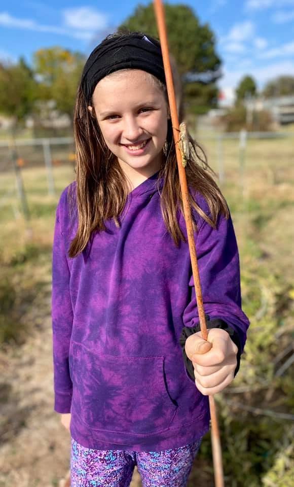 SUD Prevention Green Thumb Initiative participant exploring nature during a garden program